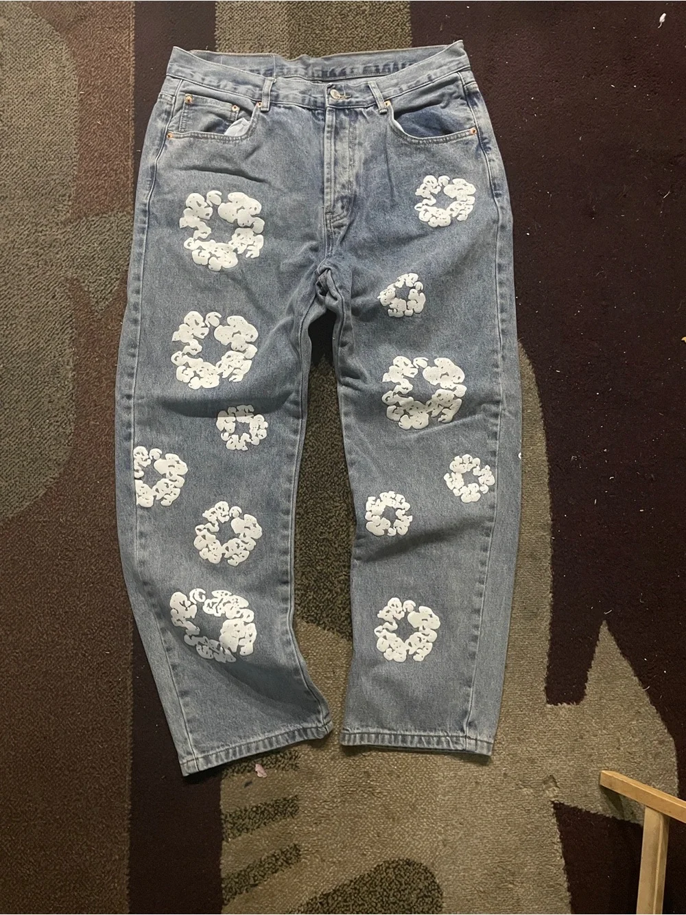 Relaxed Light Blue Jeans with White Graphic Clusters